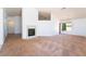 Bright living room boasts vaulted ceilings, a fireplace, and large windows for natural light at 2086 Angel Falls Dr, Henderson, NV 89074