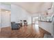 Spacious living room with fireplace, wood floors, and access to kitchen and sunroom at 2086 Angel Falls Dr, Henderson, NV 89074