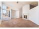 Inviting living room with fireplace, large windows, and a bright interior at 2086 Angel Falls Dr, Henderson, NV 89074