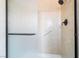 Walk-in shower features glass door and hand rails at 2086 Angel Falls Dr, Henderson, NV 89074
