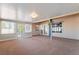 Spacious sun room with beige carpet and plenty of windows at 2086 Angel Falls Dr, Henderson, NV 89074