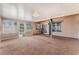 Sunroom with wall to wall windows, carpeted floor, and access to the main house at 2086 Angel Falls Dr, Henderson, NV 89074
