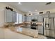 Modern kitchen featuring granite countertops, stainless steel appliances, and gray cabinets at 2114 High Mesa Dr, Henderson, NV 89012