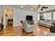 Open living room with hardwood floors, recessed lighting, and a media center at 2114 High Mesa Dr, Henderson, NV 89012