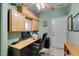 Office space featuring built-in cabinets, a desk, and a comfortable chair, ideal for remote work at 2114 High Mesa Dr, Henderson, NV 89012