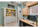 Efficient office space with built-in storage, a desk setup, and a convenient laundry area nearby at 2114 High Mesa Dr, Henderson, NV 89012