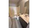 The bathroom features a shower and tub combination, vanity, and vinyl plank flooring at 2123 Sleepy Ct, Las Vegas, NV 89106