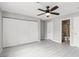 Bedroom with wood-look floors, closet, and ensuite bathroom at 2123 Sleepy Ct, Las Vegas, NV 89106