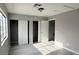 Bright bedroom featuring sleek floors, a window, and ample closet space at 2123 Sleepy Ct, Las Vegas, NV 89106