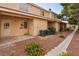 Townhome exterior with rock landscaping, walkway, and private patio at 2123 Sleepy Ct, Las Vegas, NV 89106