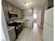 This kitchen includes stainless steel appliances, stylish cabinets, and new countertops at 2123 Sleepy Ct, Las Vegas, NV 89106
