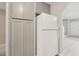 Kitchen boasts ample storage space with abundant cabinetry surrounding a clean white refrigerator at 2123 Sleepy Ct, Las Vegas, NV 89106