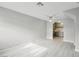 Spacious living area with wood-look floors and views into the kitchen at 2123 Sleepy Ct, Las Vegas, NV 89106