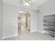 Open-concept living area with wood-look flooring and built-in shelving at 2123 Sleepy Ct, Las Vegas, NV 89106