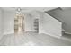 Bright living area with wood-look flooring, open floor plan, and staircase at 2123 Sleepy Ct, Las Vegas, NV 89106