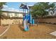 Community playground with slide and climbing features, surrounded by wood chips at 2123 Sleepy Ct, Las Vegas, NV 89106
