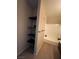 Bright bathroom features bathtub, shelves, towel rack and wood look floor at 2151 Hussium Hills St # 207, Las Vegas, NV 89108