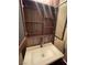 Stylish bathroom featuring modern fixtures, floating vanity, and open cabinet storage at 2151 Hussium Hills St # 207, Las Vegas, NV 89108