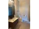 Stylish bathroom showcasing a vanity with modern fixtures and a sleek, white toilet at 2151 Hussium Hills St # 207, Las Vegas, NV 89108
