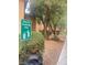 Keep our community clean sign near a bush and the sidewalk at the apartment complex at 2151 Hussium Hills St # 207, Las Vegas, NV 89108