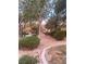 The apartment complex is well landscaped and kept with bushes and trees at 2151 Hussium Hills St # 207, Las Vegas, NV 89108