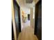 Hallway view leading into kitchen showcasing flooring and architectural design at 2151 Hussium Hills St # 207, Las Vegas, NV 89108