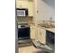 A kitchen with stainless steel appliances including an oven and a dishwasher with a matching door at 2151 Hussium Hills St # 207, Las Vegas, NV 89108