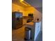 A modern kitchen with stainless steel appliances and light-colored cabinetry at 2151 Hussium Hills St # 207, Las Vegas, NV 89108