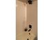 Close-up of tub with white tile surround and square shower head and fixtures at 2151 Hussium Hills St # 207, Las Vegas, NV 89108