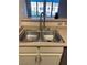 A kitchen sink with stainless steel double basin and modern faucet at 2151 Hussium Hills St # 207, Las Vegas, NV 89108