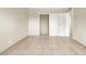 Spacious bedroom with sliding closet doors, tile floors and neutral paint at 2257 Colebrook St, Las Vegas, NV 89115
