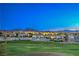 Sprawling backyard view of well-maintained homes on a hill, with scenic mountain views and blue skies at 2319 Hardin Ridge Dr, Henderson, NV 89052