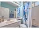 Bathroom featuring a vanity, mirror, and a shower with a butterfly shower curtain at 2319 Hardin Ridge Dr, Henderson, NV 89052