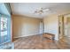Spacious bedroom featuring tile floors, ceiling fan, and ensuite bathroom access at 2319 Hardin Ridge Dr, Henderson, NV 89052