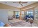 Bedroom featuring a ceiling fan, mirrored closet, and views of mountains at 2319 Hardin Ridge Dr, Henderson, NV 89052