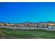Scenic view of homes along the golf course with mountains in the background at 2319 Hardin Ridge Dr, Henderson, NV 89052