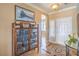 Elegant foyer with decorative tile flooring, a display cabinet, and neutral wall colors at 2319 Hardin Ridge Dr, Henderson, NV 89052