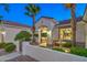 Charming front entrance with a fountain, manicured landscaping, and a welcoming gated entryway at 2319 Hardin Ridge Dr, Henderson, NV 89052