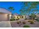 Charming single-story home featuring a two-car garage, well-manicured landscaping, and a welcoming entrance at 2319 Hardin Ridge Dr, Henderson, NV 89052