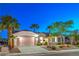 Charming single-story home featuring a two-car garage, well-manicured landscaping, and a welcoming entrance at 2319 Hardin Ridge Dr, Henderson, NV 89052