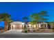 Charming single-story home featuring a two-car garage, well-manicured landscaping, and a welcoming entrance at 2319 Hardin Ridge Dr, Henderson, NV 89052
