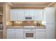 Kitchen featuring white cabinetry and modern appliances at 2319 Hardin Ridge Dr, Henderson, NV 89052