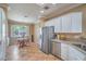 Kitchen with breakfast nook featuring a stainless fridge, tile floors, and modern appliances at 2319 Hardin Ridge Dr, Henderson, NV 89052