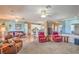Spacious living room with open layout to kitchen, comfortable seating, and neutral carpet at 2319 Hardin Ridge Dr, Henderson, NV 89052