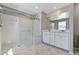 Primary bath with a glass shower, tiled floor and double sink vanity at 2456 Bagnara Pl, Henderson, NV 89044
