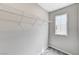 Walk-in closet with carpeted floors, wire shelving, and a window at 2456 Bagnara Pl, Henderson, NV 89044