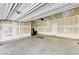This two car garage features a concrete floor and white walls, offering a clean and spacious area at 2456 Bagnara Pl, Henderson, NV 89044