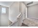 Upstairs hallway with carpet, white trim, and natural light from the window at 2456 Bagnara Pl, Henderson, NV 89044