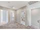 Bright upstairs hallway leading to bedrooms and bathrooms with carpeted flooring at 2456 Bagnara Pl, Henderson, NV 89044