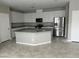 Spacious kitchen with white cabinets, granite countertops, and stainless steel appliances at 2456 Bagnara Pl, Henderson, NV 89044